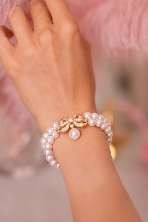 Open image in slideshow, &#39;Sissi&#39; Double Strand Pearl Bracelet with Gold Bow
